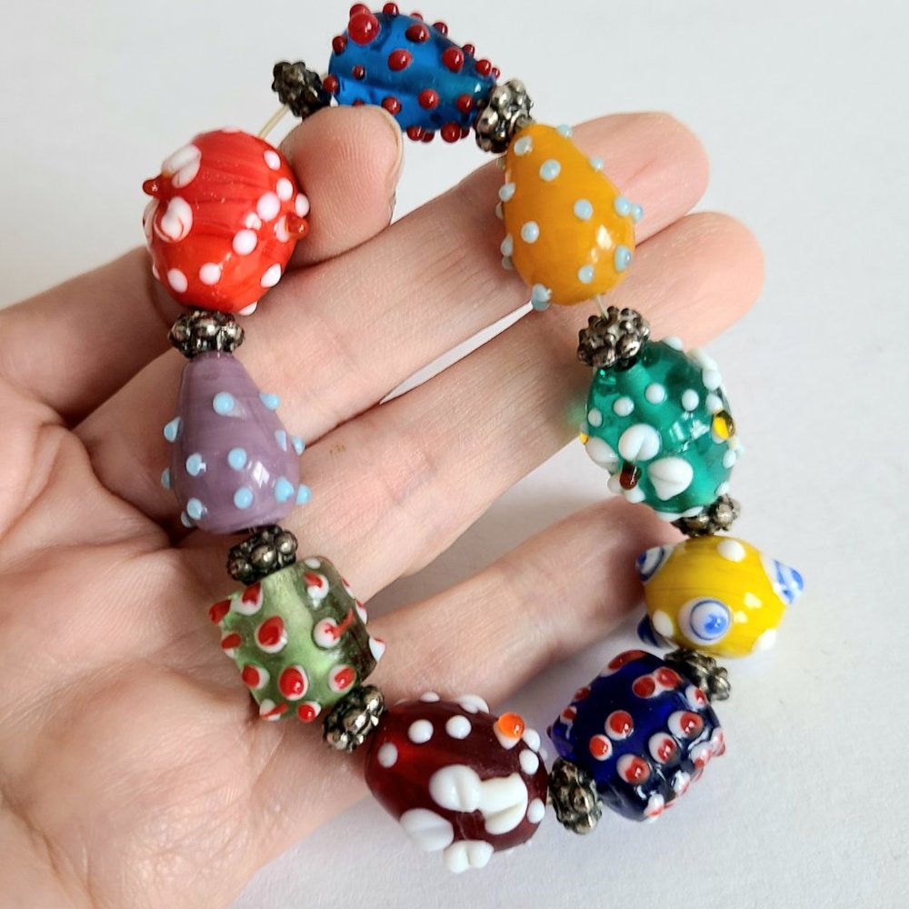 9 handmade lampwork glass beads.